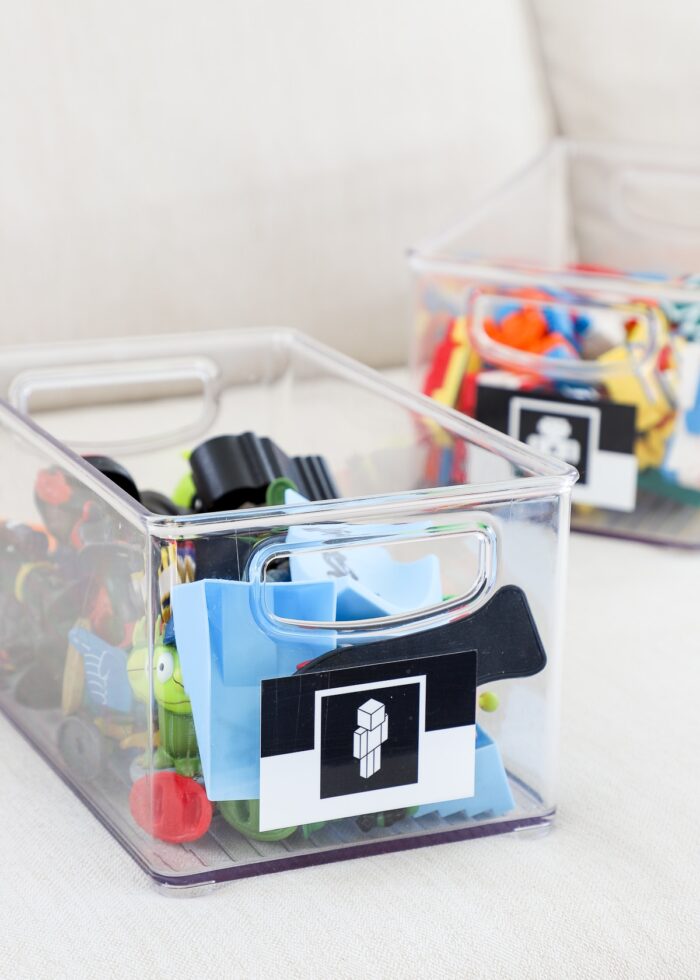 Clear acrylic bins serving as small toy storage