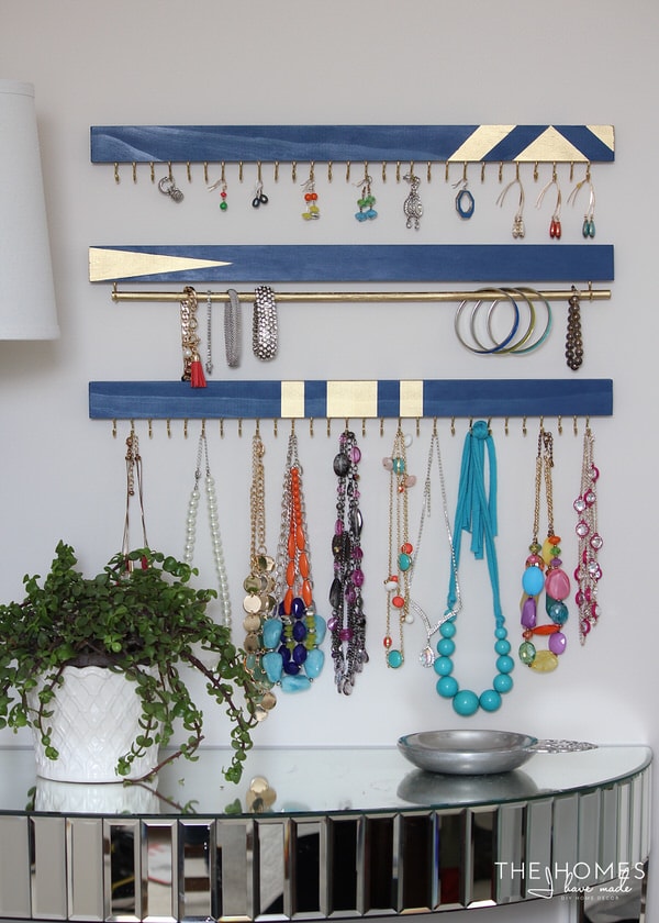 DIY Jewelry Organizer holding bracelets, earrings, and necklaces