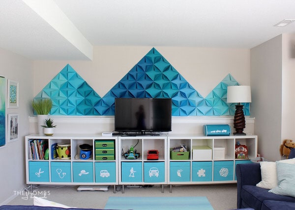 Check out how this military family transformed their rental basement into a fun and functional playroom complete with smart toy storage and whimsical DIY decorations!