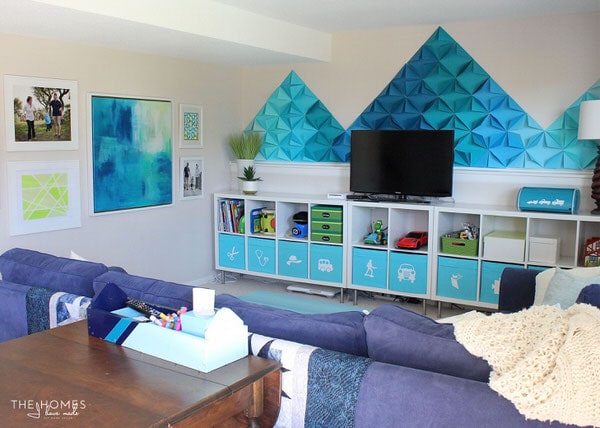 Check out how this military family transformed their rental basement into a fun and functional playroom complete with smart toy storage and whimsical DIY decorations!