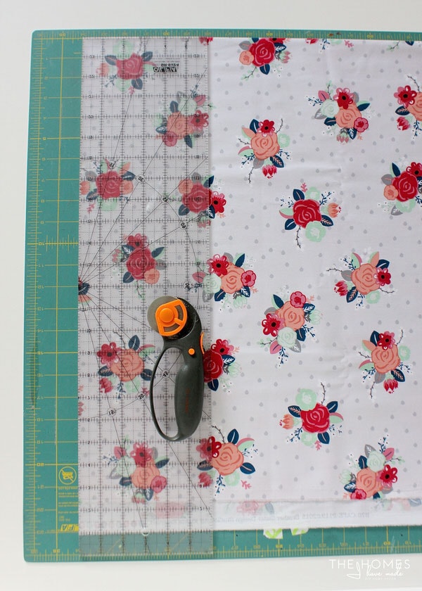 floral home decor fabric on a cutting mat