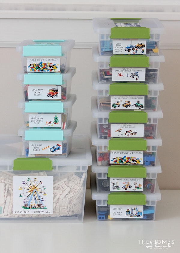 Clear bins with labels stacked vertically on top of each other containing Lego pieces that match each label description