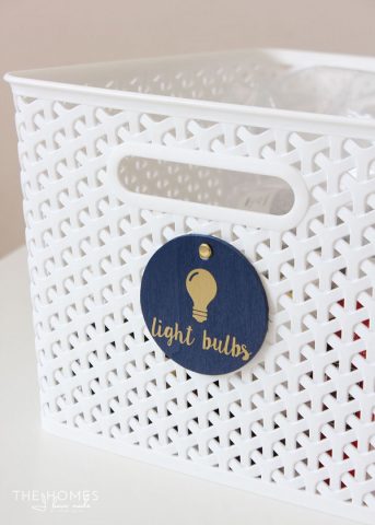 Use chipboard rounds and vinyl letters to labels linen closet baskets!