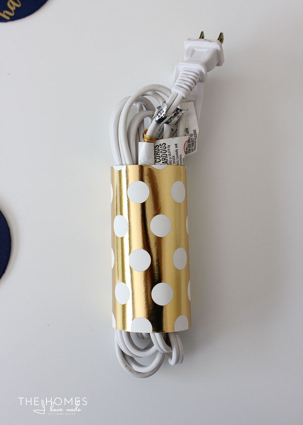 Corral un-tidy cords by wrapping them in cardboard tubes!