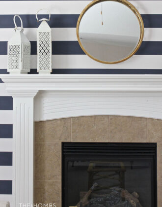 Neutral furniture and colorful accessories transform this boring rental living room into a preppy and playful family space!