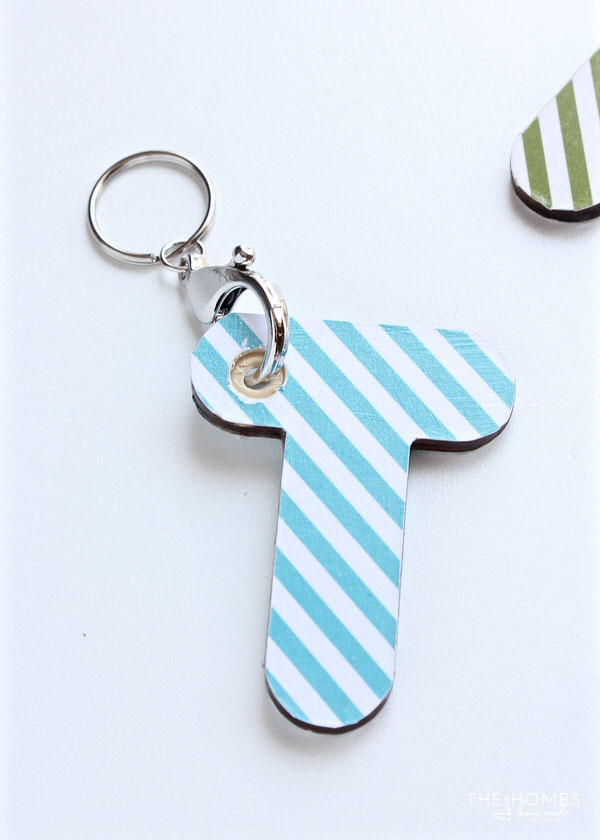 Ever see all those fun wood shapes and letters at the craft store and wonder what you could do with them? Learn how to easy it is to transform them into personalized key chains!
