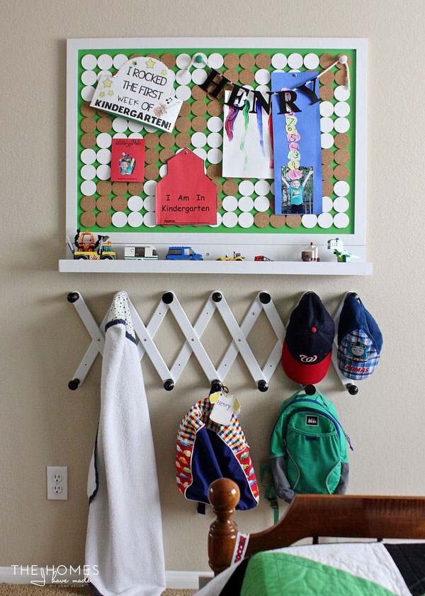 A bulletin board, picture ledge, and set of hooks come together to make the perfect drop zone for any kid space!