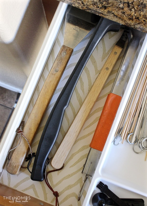 Grille tools in an organized kitchen drawer