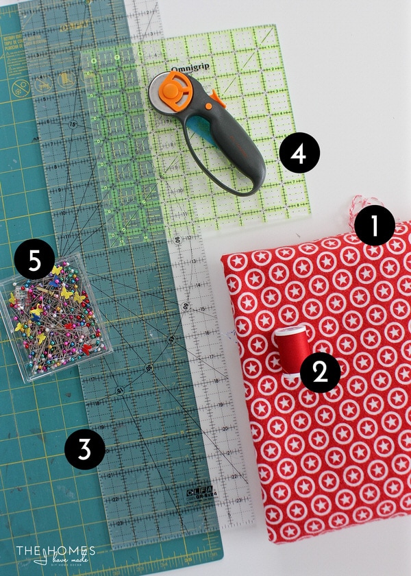Tools needed to sew boxed corners: rotary cutter, rulers, fabric, pins, and thread