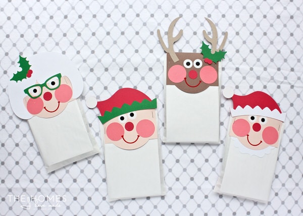 Christmas Treat Bag Toppers that look like Santa, Mrs. Clause, Elf, and Reindeer