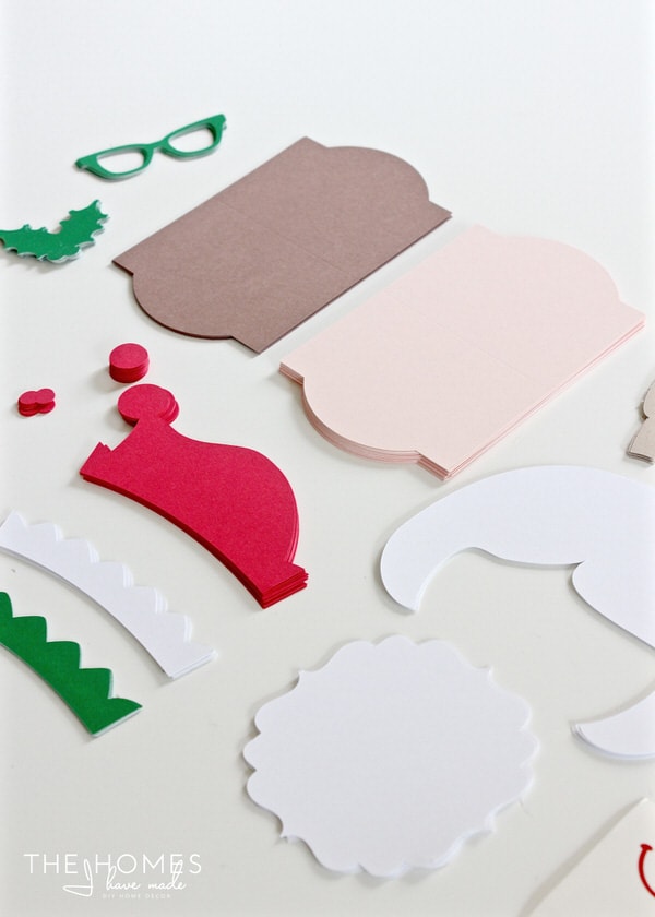 Various elements of the treat bag toppers cut from colored cardstock