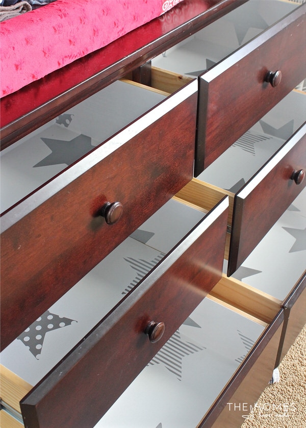 Learn how to line drawers with wallpaper for a great pop of pattern with professional-looking results!
