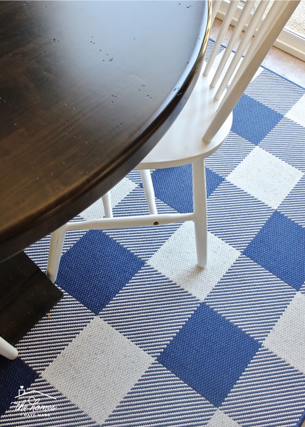 A rug under a kitchen table and chair