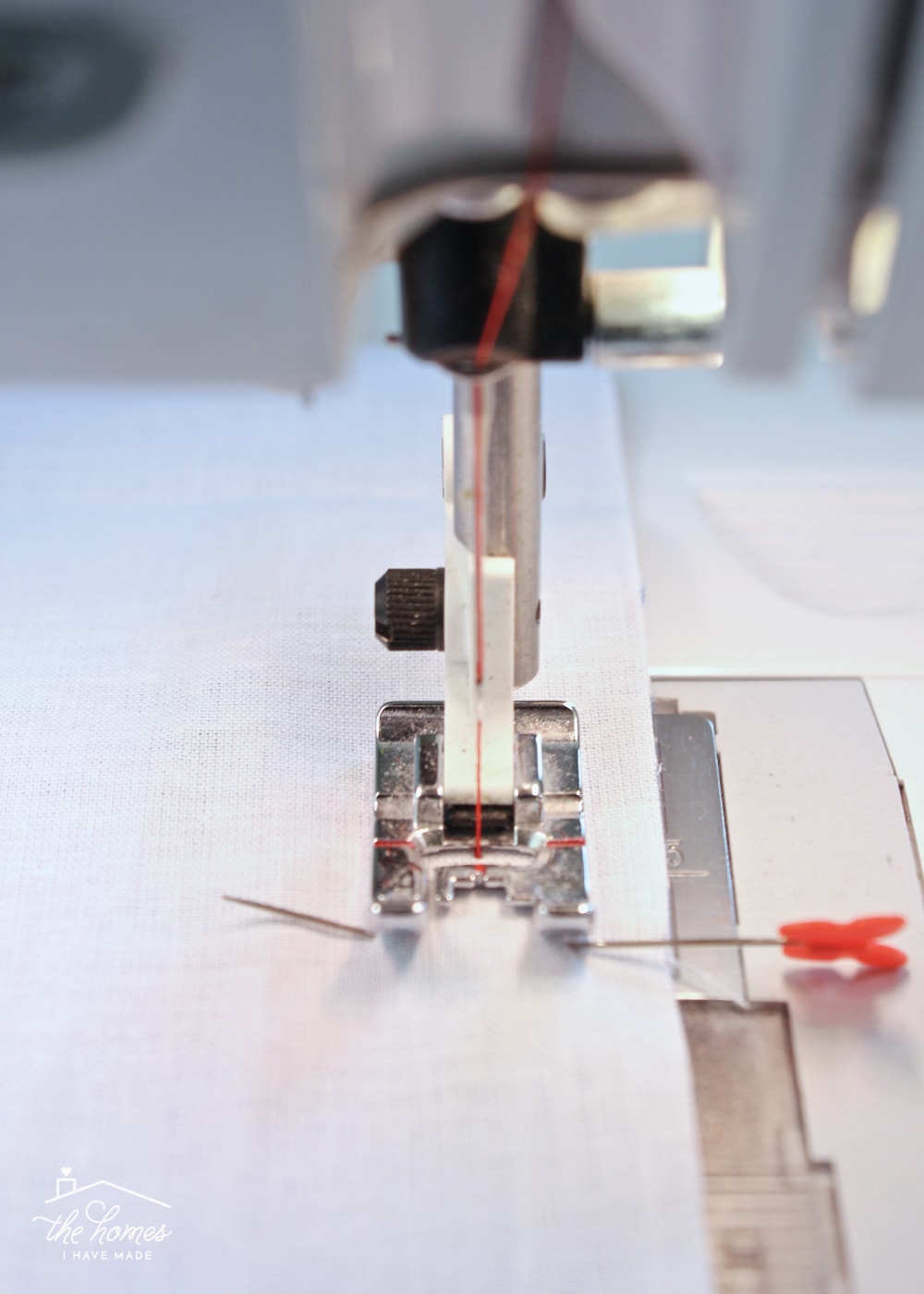 a piece of fabric going through a sewing machine