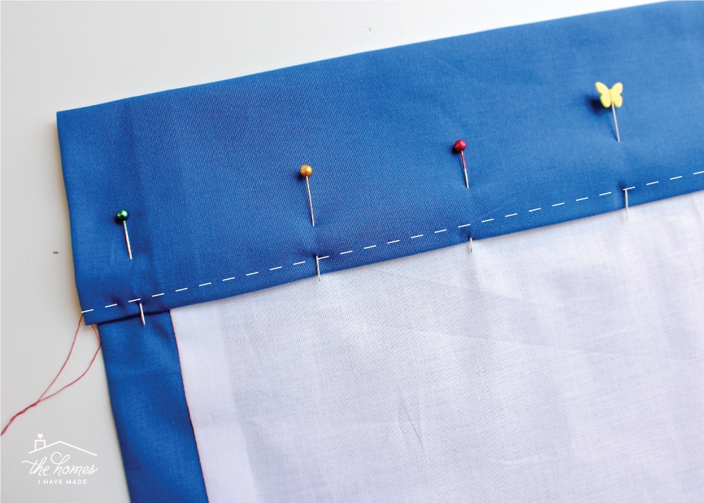 piece of fabric with the top folder over pinned and hemmed in place
