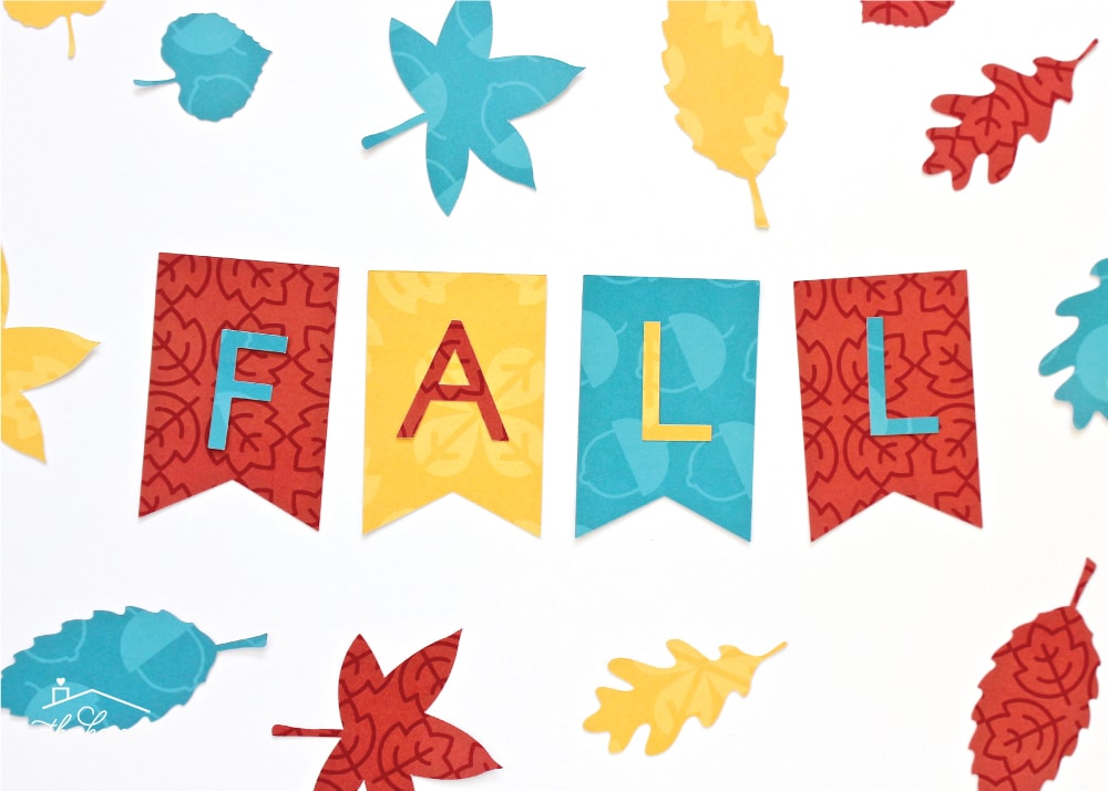 A variety of Fall leaves and banner cut from patterned scrap book paper.