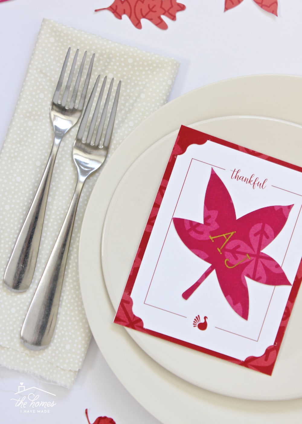 Cream dishes shown with red Thankful Card and red leaf Thanksgiving Place Card.