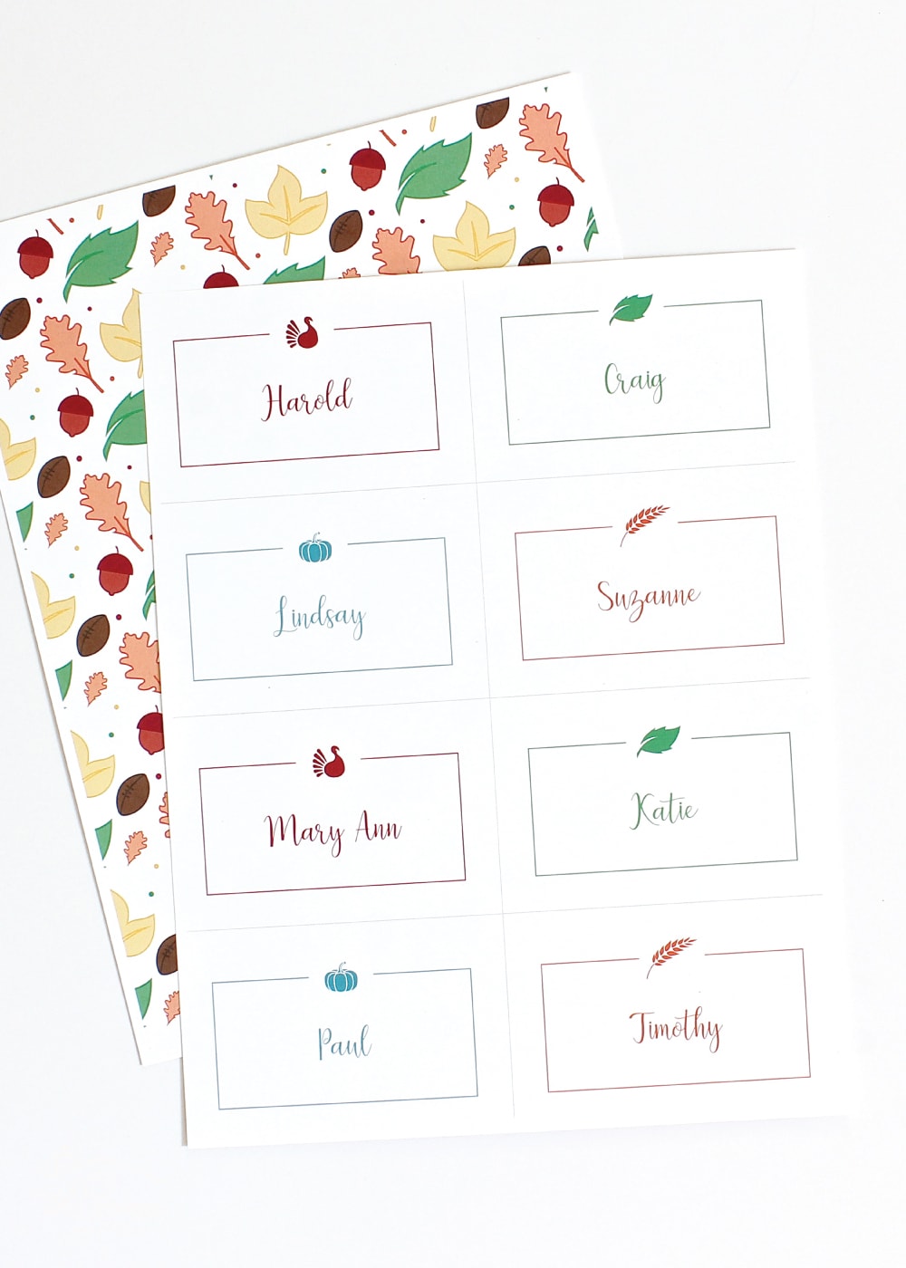 Printable Thanksgiving Place Cards shown 8 per page shown with Fall patterned paper.