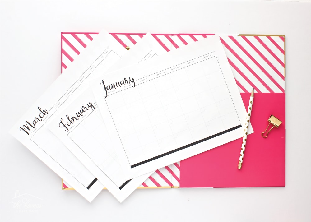 Black and white printable blank monthly calendar pages on a hot pink folder