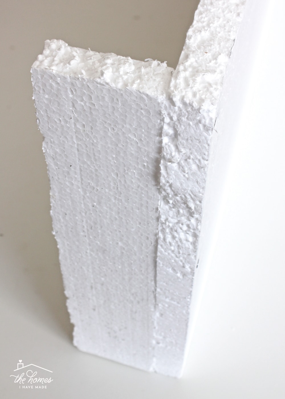 two pieces of foam are attached perpendicular 
