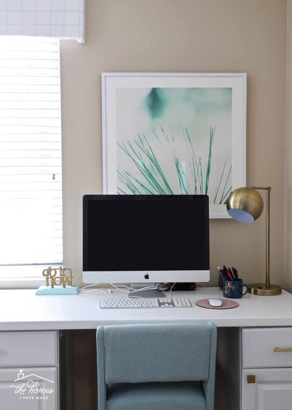a white window valence hanging in a home office.