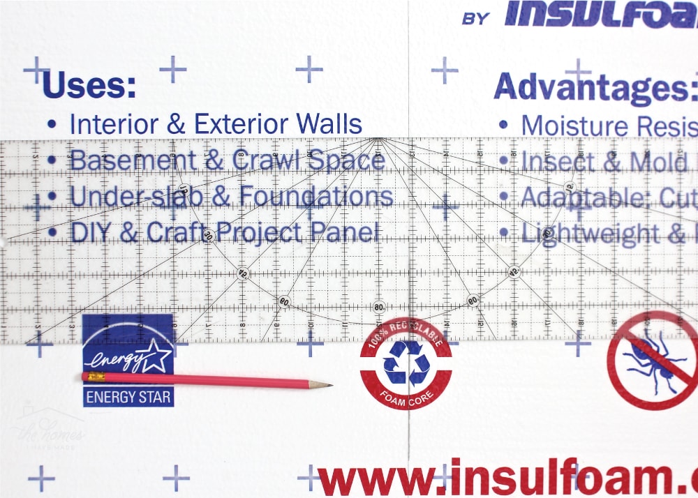 a clear ruler, pencil and piece of foam board insulation