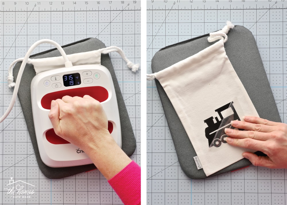 Hand holding Cricut EasyPress to apply iron-on label.
