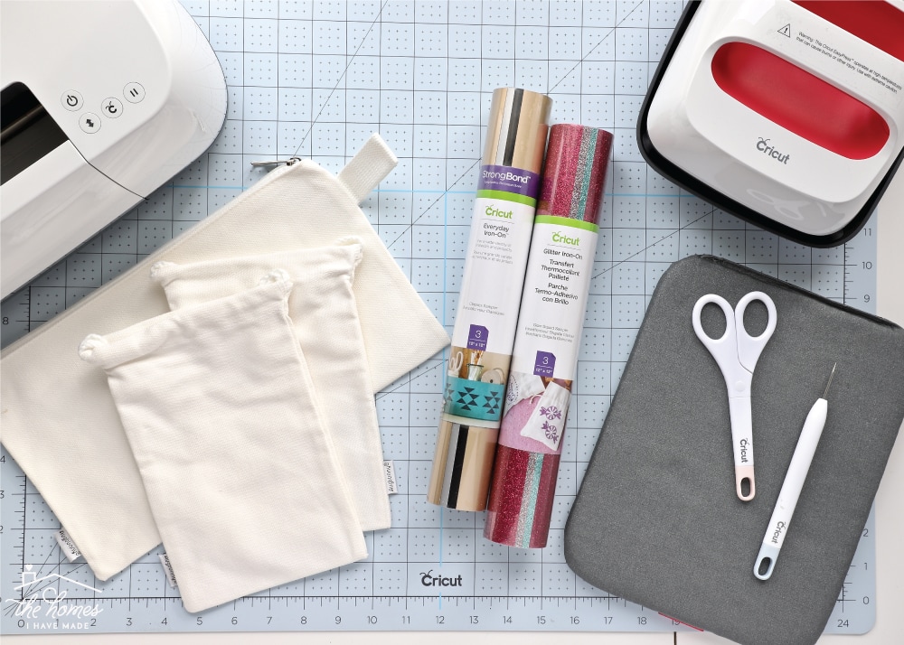 An array of craft supplies needed to make iron-on labels with a Cricut machine