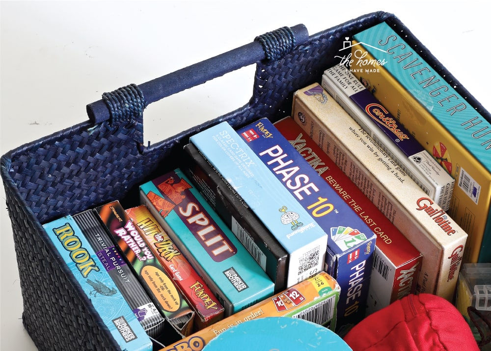 Landscapre image of card games and small boardgames organized in storage basket