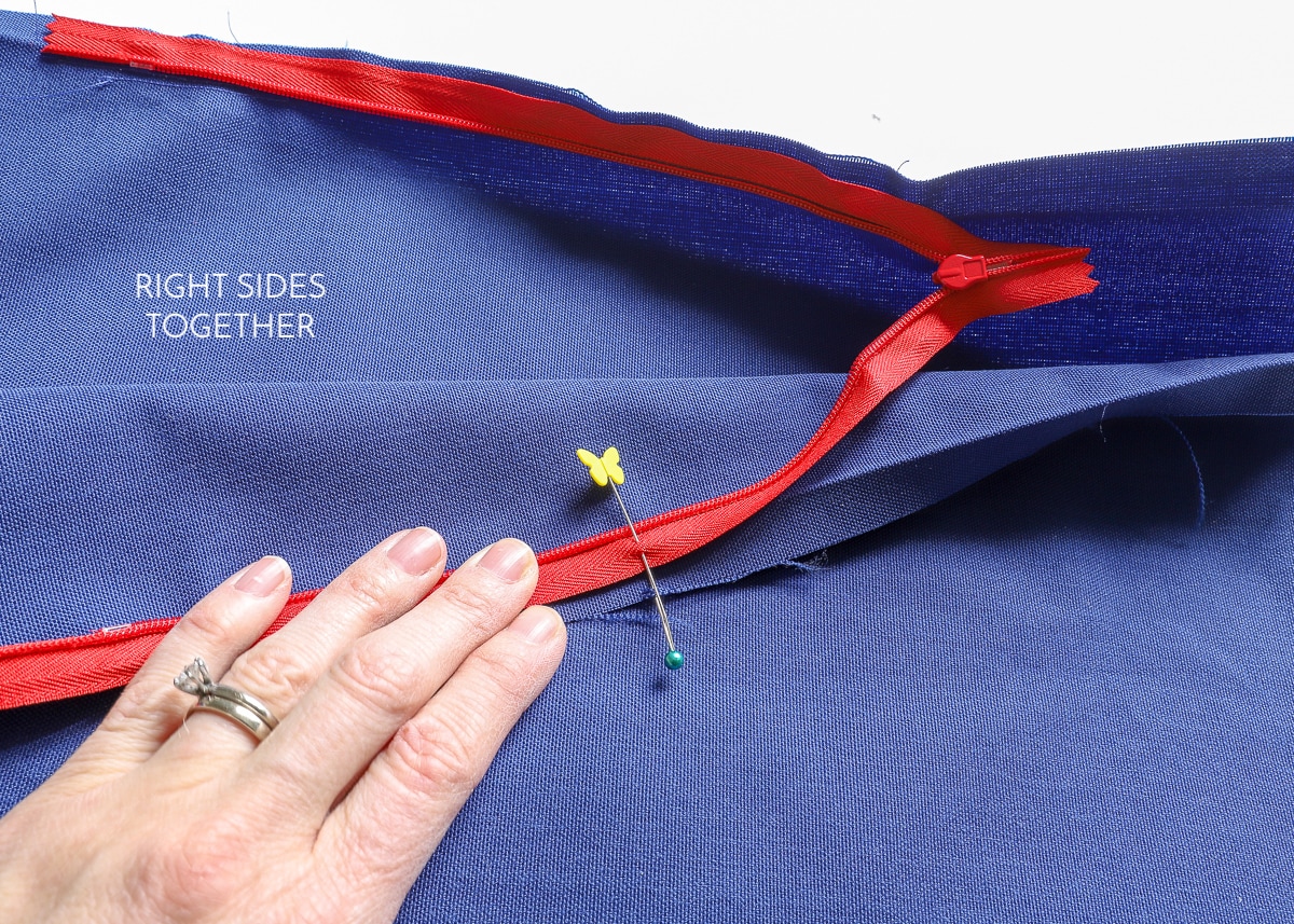 the opposite side of the zipper is pinned tot the fabric