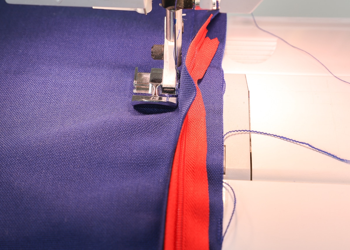 A regular zipper foot is used to sew two pillow covers together