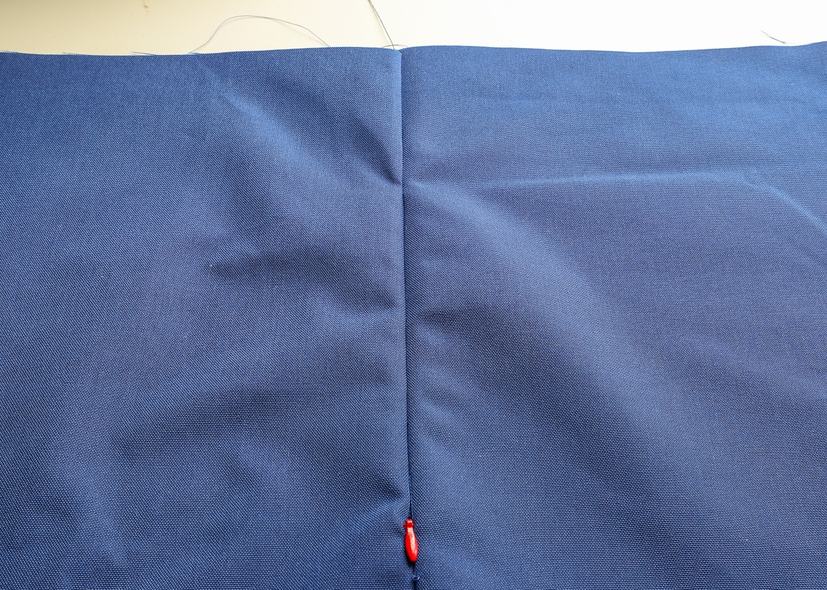 two pieces of blue fabric sew together with an invisible zipper