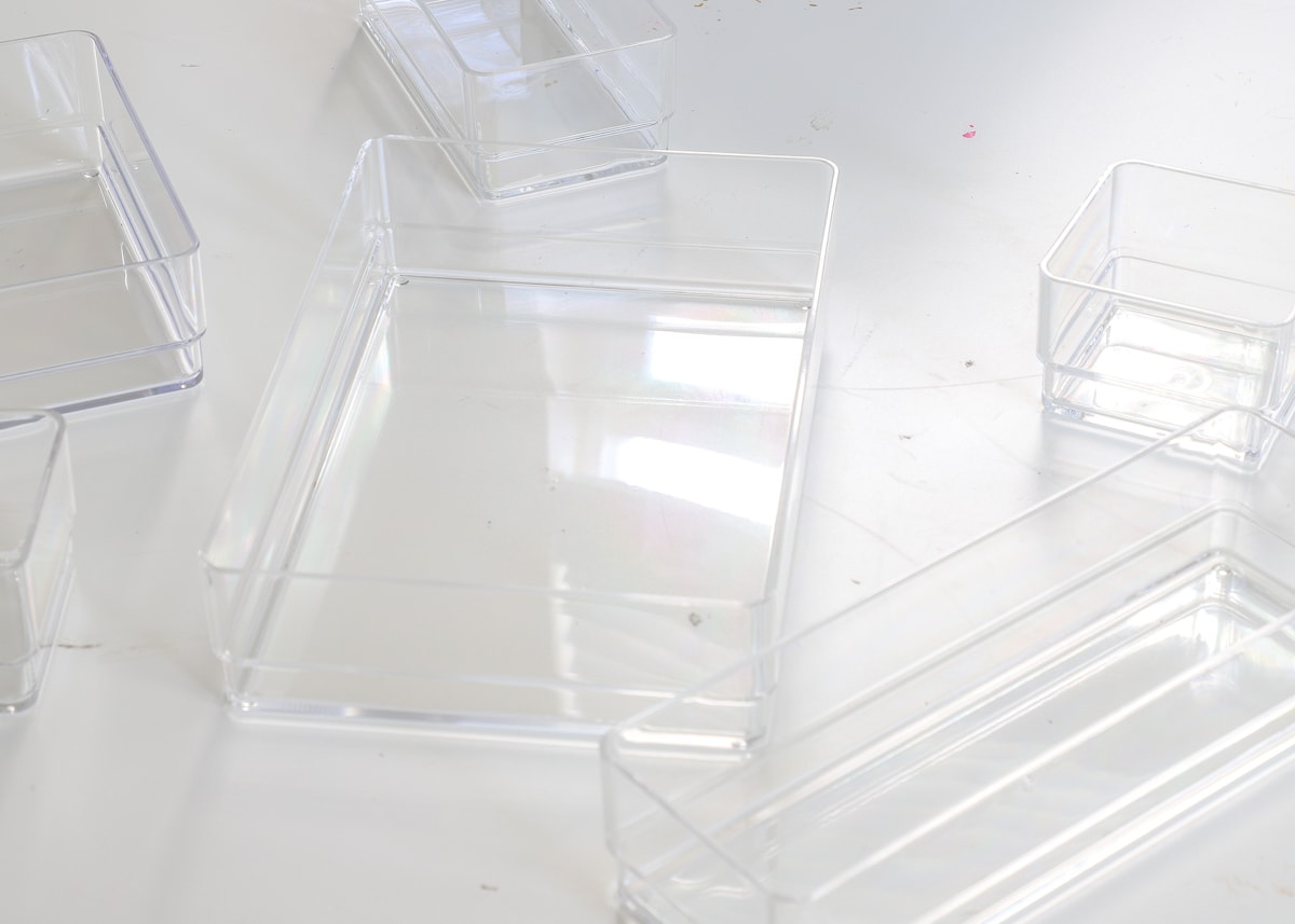 Clear acrylic drawer organizers of varying sizes
