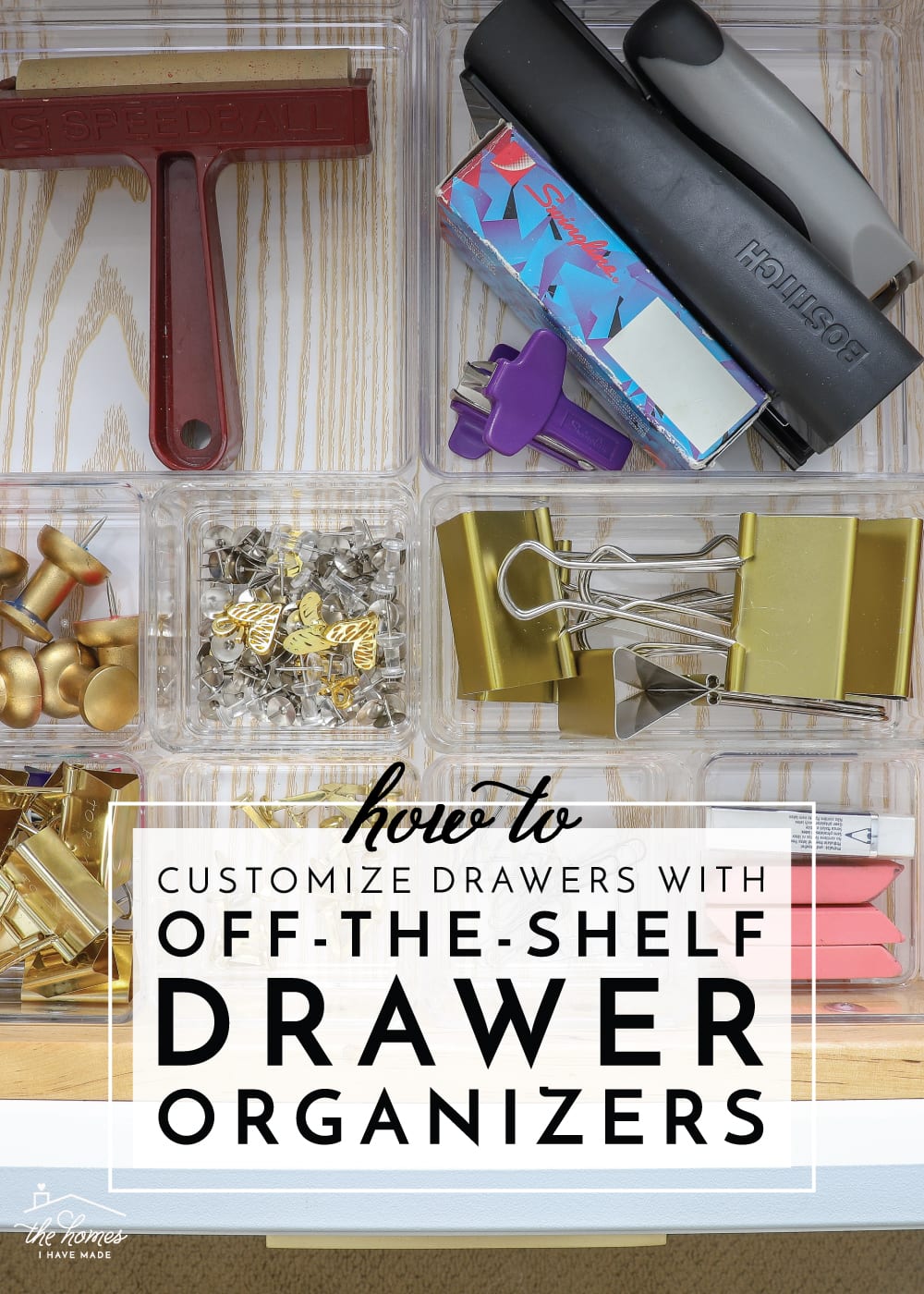 A drawer full of office and craft items organized with drawer organizers