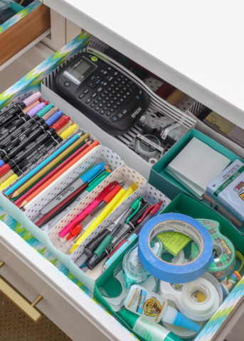 A drawer full of office and craft items