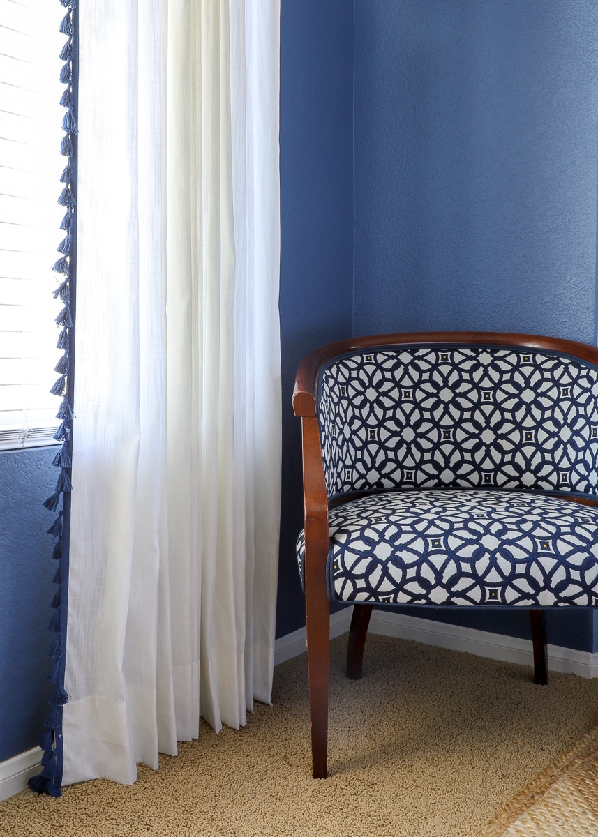 curtains hanging next to an accent chair