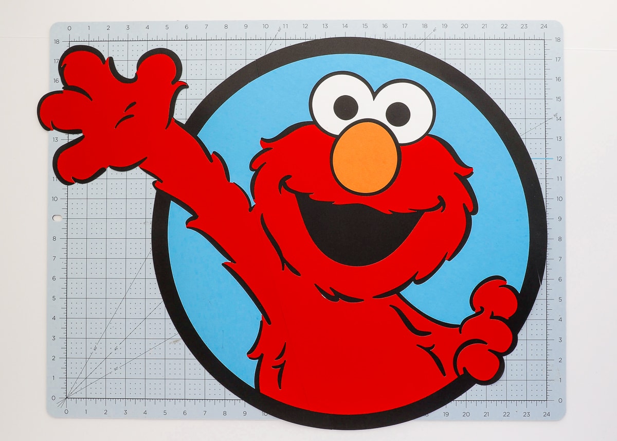 Elmo character print out on top of a Cricut cutting mat