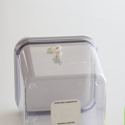 A clear container with clue removed