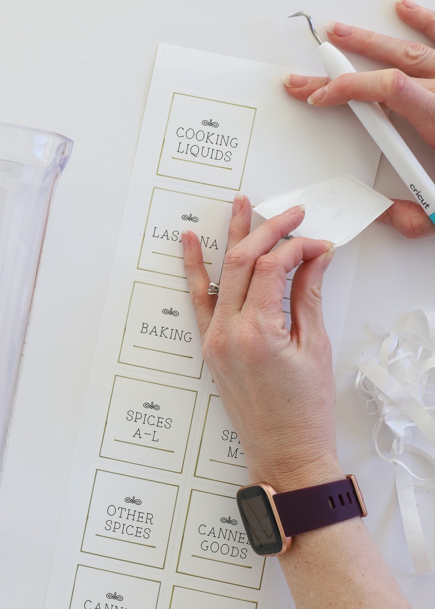 Peeling off a label made by a cricut joy machine