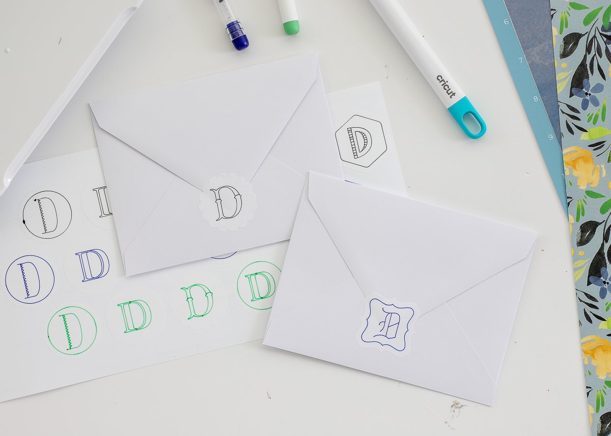 Monogrammed stickers seal envelopes