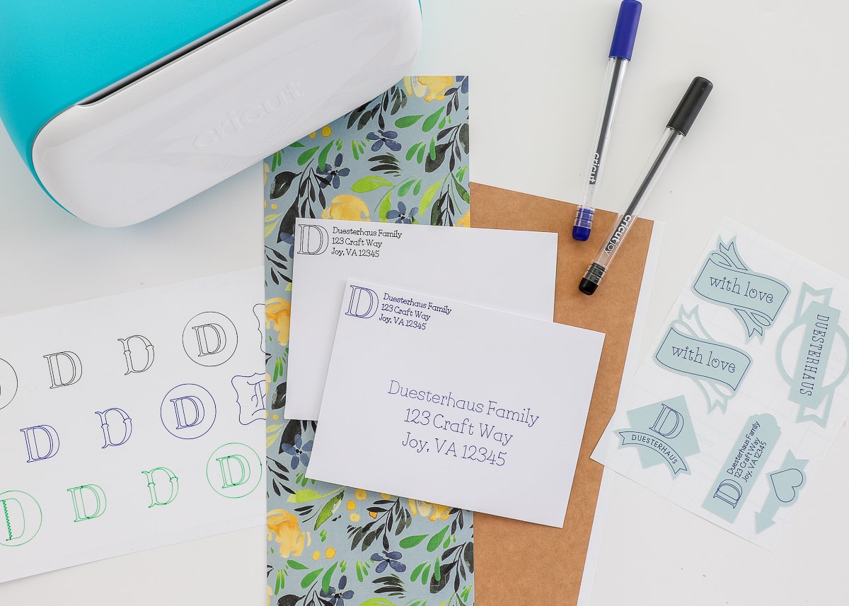 A variety of Cricut designs used to address envelopes