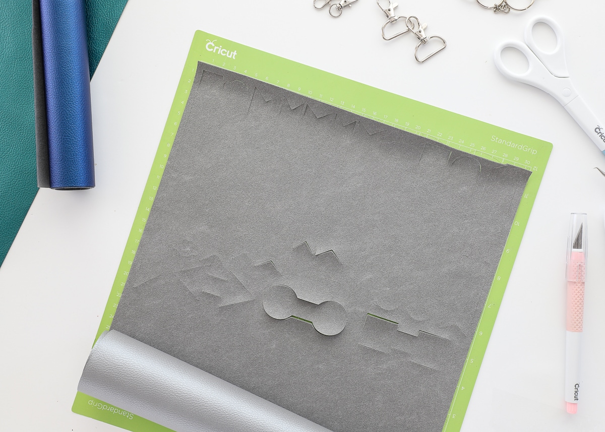 Key chain shapes are cut with a Cricut