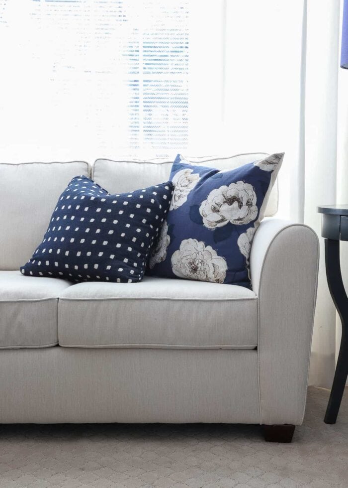 White couch in Sunbrella fabric with blue microfiber ottoman