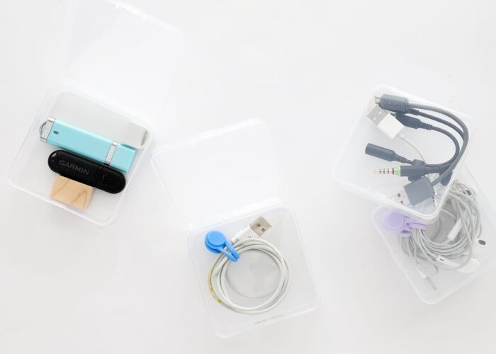 Cords wound and organized in small plastic boxes