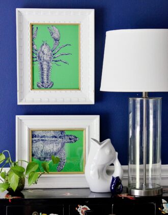 White frames with blue and green sea life pop art on a blue wall