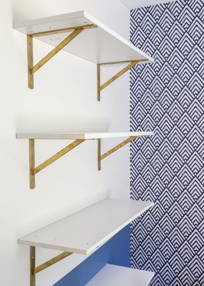 White shelves with gold brackets.