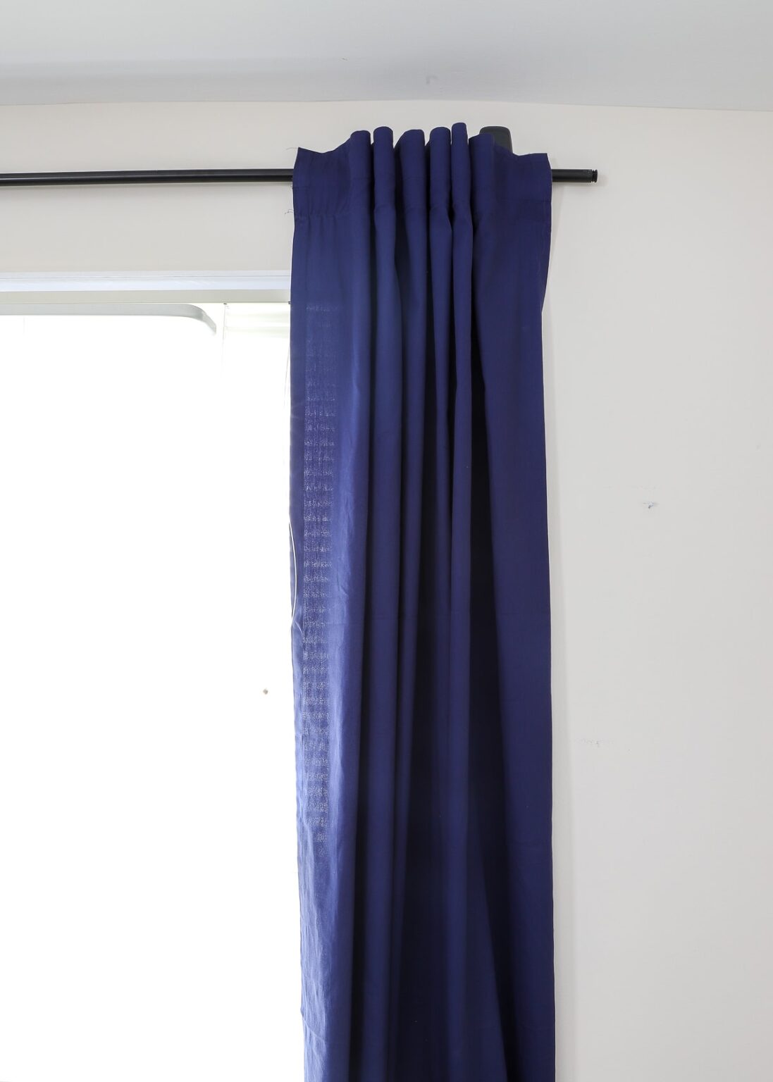 How to Hang a Curtain Rod Without Drilling into the Wall