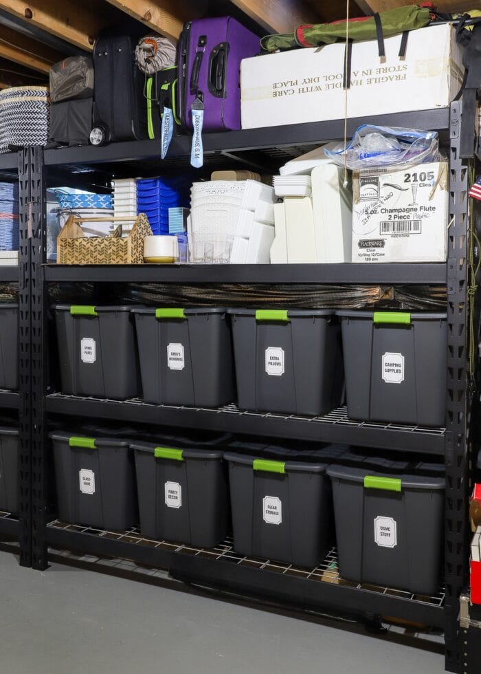 Vertical picture of black metal storage shelves loaded with bins, baskets, and boxes.