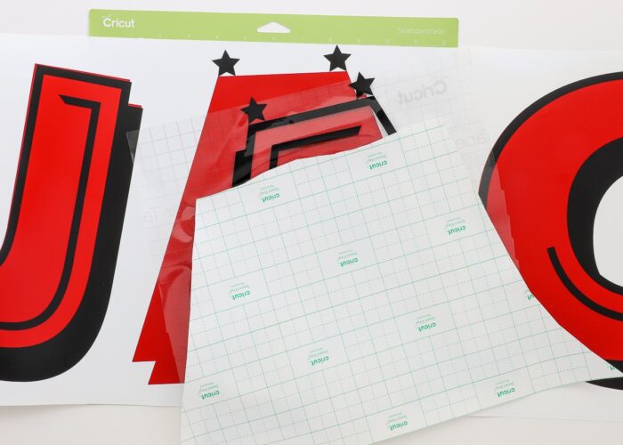 Star registration marks used to layer red and black vinyl letters