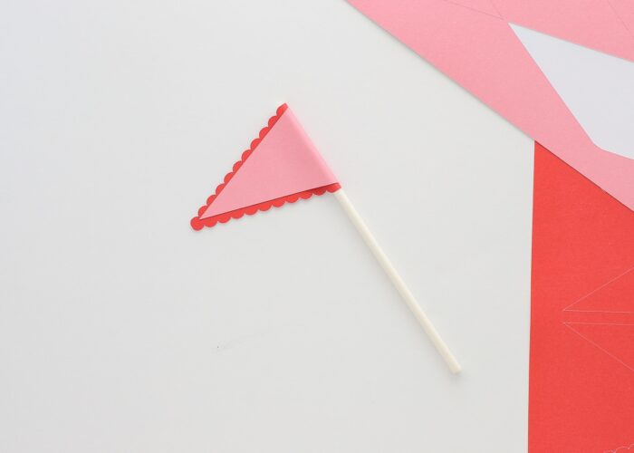 Red and pink pennant cupcake topper made with a Cricut